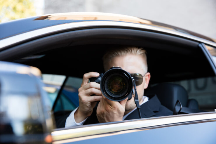 Man Photographing With SLR Camera